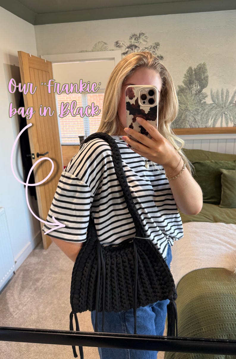 May include: Black Frankie bag with a braided strap and fringe detail. The bag is made of a thick, textured material. The text "Our Frankie bag in Black" is visible in the image.