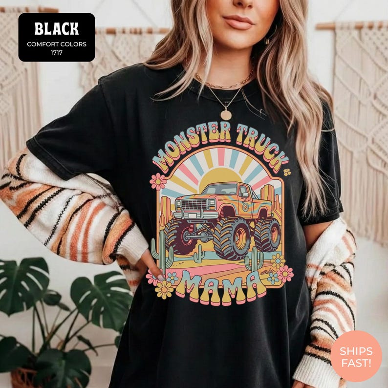 Comfort Colors graphic tee featuring a retro groovy monster truck with floral details, desert cacti, and a sunburst backdrop, arched text reading Monster Truck Mama, designed for moms of boys, Monster Jam fans, and birthday party season.