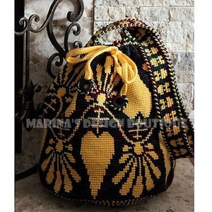 May include: A yellow and black crocheted drawstring bag with a heart design. The bag has a long strap and is made with a colourful pattern.
