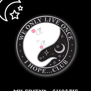 May include: A circular pin badge with a ghost-themed yin-yang design in black and white. The text reads "WE ONLY LIVE ONCE" and "I HOPE...CLUB". The words "MY FRIEND, GHOSTIE" are at the bottom.