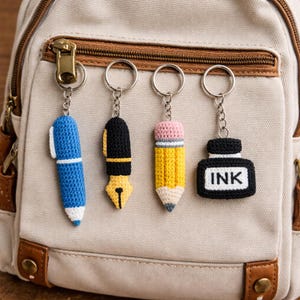 May include: A set of three ceramic mugs with a speckled, matte finish. The mugs are in shades of cream, light grey, and dark grey. Each mug has a simple, minimalist design, perfect for coffee or tea.