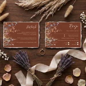 May include: Two rectangular cards with deckled edges and a terracotta background featuring floral illustrations. The left card is titled Details and the right card is titled RSVP. Both cards include white text and are surrounded by dried flowers.