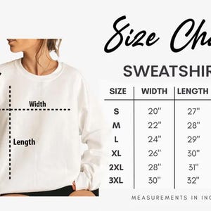 May include: A white sweatshirt with a size chart. The chart displays measurements in inches for width, length, and sleeve length for sizes S to 3XL. The text "Size Chart" is at the top.