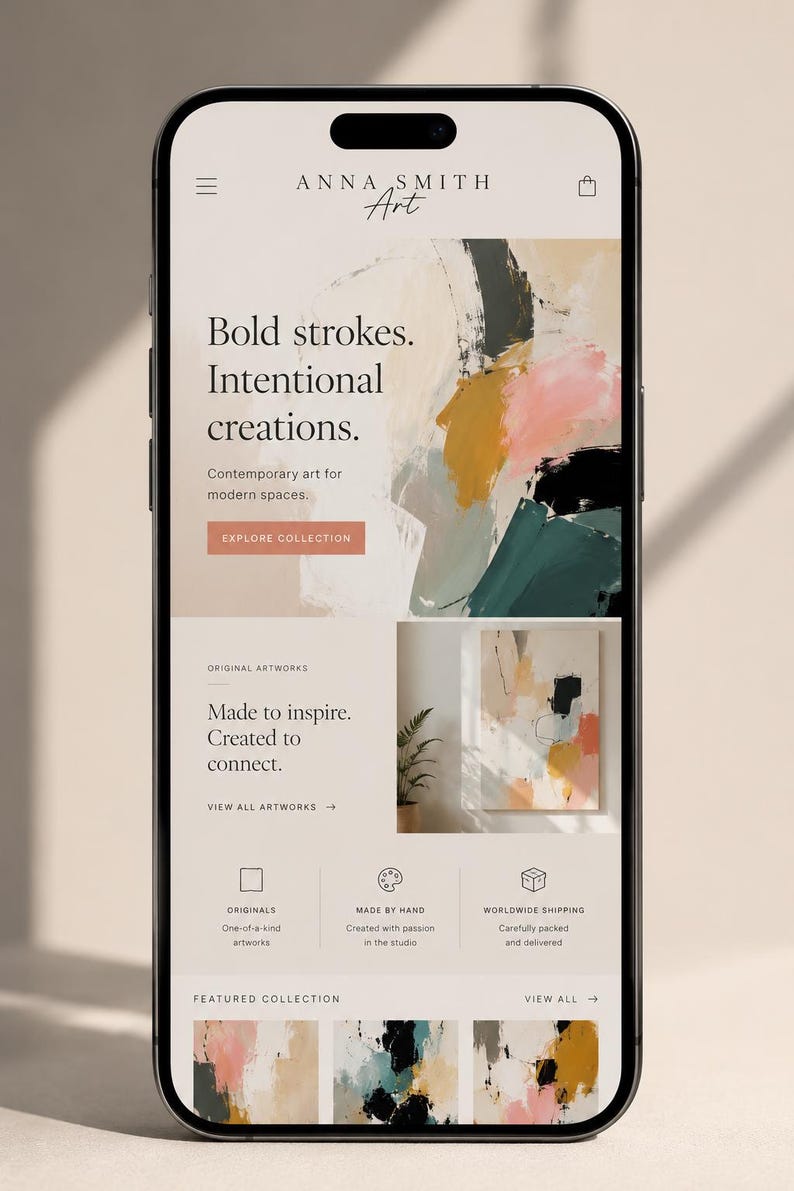 May include: A smartphone displaying a website for Anna Smith Art. The interface features a hero section with abstract painting, text reading Bold strokes. Intentional creations., and a button labeled EXPLORE COLLECTION. Below are sections for original artworks, service icons, and a featured collection.