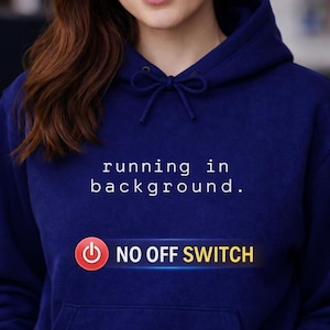 May include: A navy blue hoodie with the text "running in background." and "NO OFF SWITCH" printed on the front. The sweatshirt features a drawstring hood and a kangaroo pocket. The text is white, and "NO OFF SWITCH" is on a yellow bar.