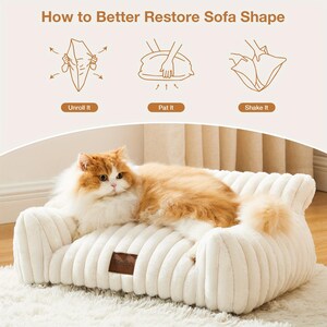 May include: A cream corduroy pet sofa with a ginger and white cat lying on it. The sofa has a brown leather tag with the word "Cherish". The image also includes instructions on how to restore the sofa shape.