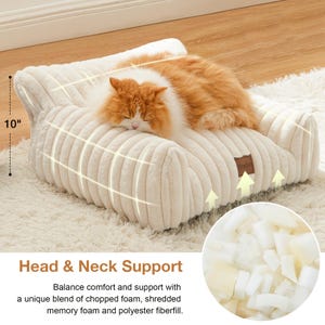 May include: A beige corduroy pet bed with a sleeping ginger and white cat. The bed is 25 cm high and has a headrest. The text "Head & Neck Support" is visible, along with a description of the bed's materials.