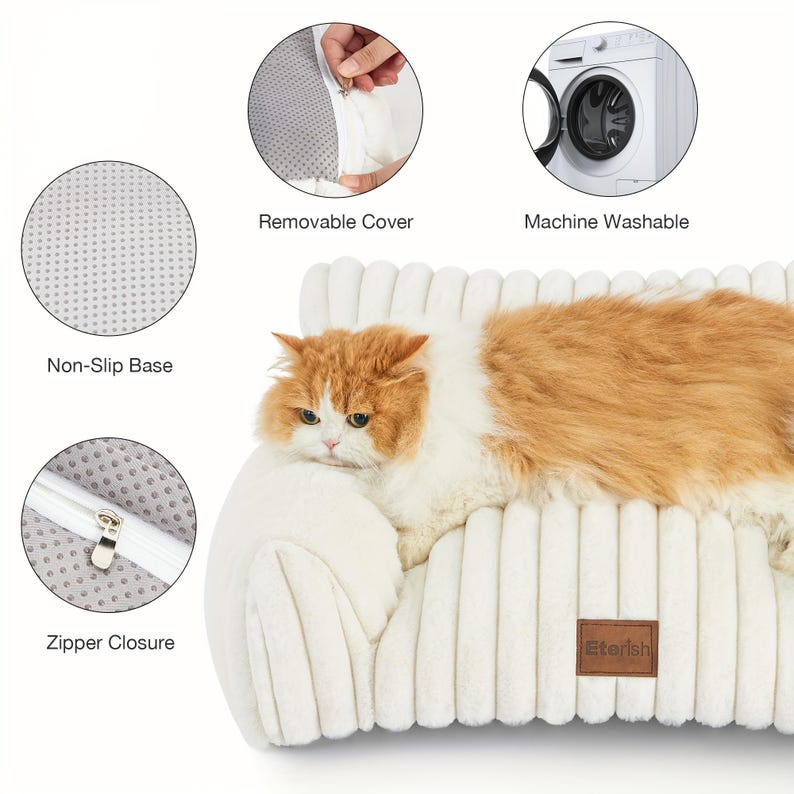 May include: A cream-coloured pet bed with a corduroy texture, featuring a non-slip base and a removable cover. An orange and white cat is resting on the bed. The bed has a zip closure and is machine washable.