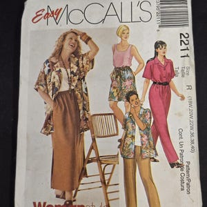 May include: McCall's Easy 2211 sewing pattern envelope featuring illustrations of various outfits including a long skirt, floral shirt, shorts, and a jumpsuit. The text includes the brand name, pattern number 2211, and size range 18W to 40.