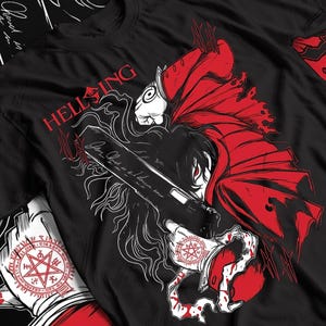May include: A black t-shirt featuring a graphic illustration of a character in a red coat holding a large black handgun. The text HELLSING is printed in red above the character. A white circular seal with a red pentagram is visible on the sleeve.