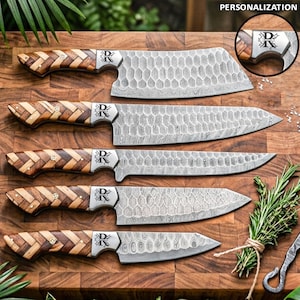 May include: A set of five personalized kitchen knives with wooden handles and patterned blades. The handles have a woven wood design. The blades have a honeycomb pattern. The knives are arranged on a wooden cutting board. The word "PERSONALIZATION" is in the top right corner.