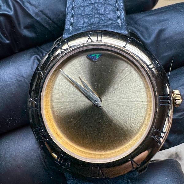 Chopard branded Frédérique Piguet caliber 21 in a customized exhibition case with a leather strap.