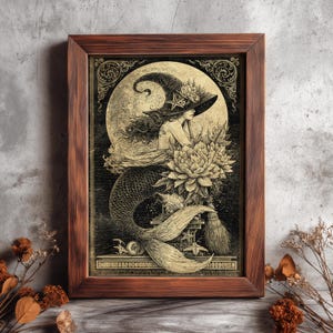 May include: A framed print featuring a mermaid witch illustration. The artwork depicts a mermaid wearing a witch hat, with a large moon in the background. The color palette is sepia tones with intricate details.