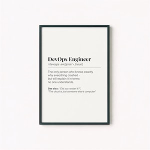 May include: A framed print with the text "DevOps Engineer" and a definition. The definition reads: "The only person who knows exactly why everything crashed - but will explain it in terms no one understands." Includes the phrases "Did you restart it?" and "The cloud is just someone else's computer."