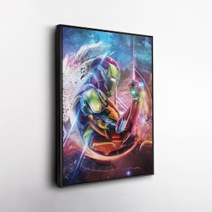 May include: Framed artwork featuring Iron Man in a dynamic pose. The artwork showcases Iron Man's suit with vibrant red, gold, and blue hues, set against a cosmic background. The image is framed in a sleek black border, adding a modern touch.
