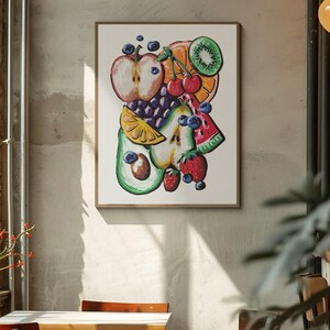 May include: A framed art print featuring a colorful illustration of various fruits. The artwork includes an apple, orange, kiwi, cherries, grapes, pear, lemon, avocado, watermelon, strawberries, and blueberries. The painting is set against a neutral background.