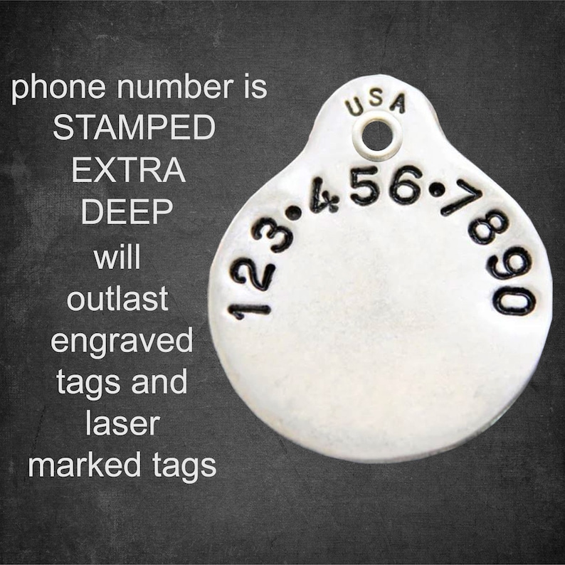 May include: A silver round pet tag with a stamped phone number, "123.456.7890", and the text "USA". The tag is designed to outlast engraved and laser-marked tags.