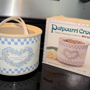 May include: A set of three ceramic mugs with a speckled, matte finish. The mugs are in shades of cream, light gray, and dark gray. Each mug has a simple, minimalist design, perfect for coffee or tea.