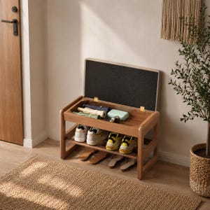 May include: A wooden shoe storage bench with a hinged lid that opens to reveal a storage compartment. The bench features a lower shelf holding two pairs of sneakers and two pairs of sandals, while the top compartment contains small items.