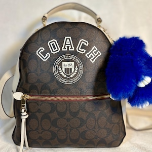 coach black jordyn backpack Leather in Signature perforated leather and smooth leather Inside zip pocket Zip closure fabric lining Top handle with 2 drop Outside zip pocket Adjustable shoulder straps 10 1/2 (L) x 12 1/4 (H) x 3 3/4 (W) Style No Coach Women's Jordyn Backpack (Blocked