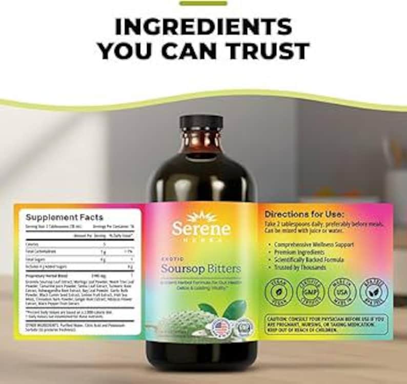 May include: A dark glass bottle of "Serene Herbs Soursop Bitters" with a colorful label. The label includes the text "Ingredients You Can Trust", "Supplement Facts", and "Directions for Use". The bottle is on a wooden surface.