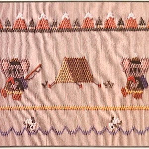 May include: Cross-stitch pattern featuring two cartoon bears camping in the mountains. The bears are wearing hats and backpacks. One bear is holding a fishing rod. The other bear is holding a cup. There is a tent in the middle of the scene. The mountains are in the background.