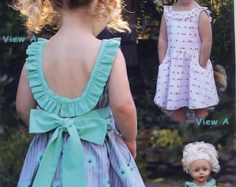 Penelope is a Girls Dress With a Ruffled Neck and Scooped Back, by Olive Ann Designs
