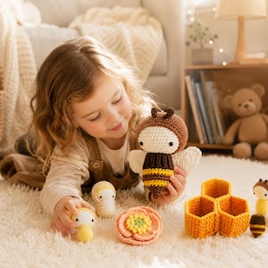 May include: A collection of handmade crochet toys, including a bee, honeycomb, flower, and other figures. The bee toy is brown, yellow, and white, with small wings. The toys are arranged on a fluffy, cream-colored rug.