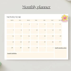 May include: A monthly planner with a cream-colored background. The planner features a calendar grid with dates and spaces for notes. The top of the planner has the text "Monthly planner" and "MONTH/YEAR". A cartoon flower is in the upper right corner.