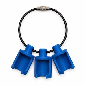 May include: A black circular cable ring with a silver-toned metal screw closure, featuring three identical blue plastic cylindrical components attached to the cable, each with a rectangular cutout on the front side of the cylinder.