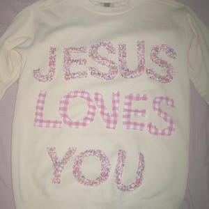 May include: A set of three ceramic mugs with a speckled, matte finish. The mugs are in shades of cream, light gray, and dark gray. Each mug has a simple, minimalist design, perfect for coffee or tea.