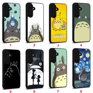 May include: A collection of eight phone cases featuring designs inspired by the animated film "My Neighbor Totoro." The cases showcase various characters and scenes, including Totoro, Pikachu, and a starry night design. Each case has a black border.