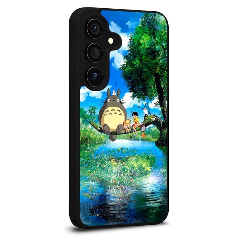 May include: Black phone case featuring a colorful illustration of characters from the animated film, My Neighbor Totoro. The design shows Totoro and other characters sitting on a tree branch over a body of water with a blue sky background.