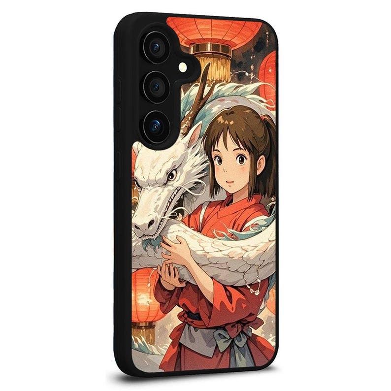 May include: Black phone case featuring a colorful anime illustration. The design showcases a girl in a red outfit embracing a white dragon, with red lanterns in the background. The case has a black border and a camera module.