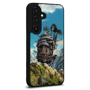 May include: Black phone case featuring a colorful illustration of a moving castle against a blue sky with clouds. The case has a black border and a camera cutout.