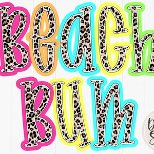 May include: A vibrant graphic featuring the text "Beach Bum" in bold, leopard-print letters. The letters are outlined in a variety of bright colours, including pink, orange, turquoise, and green. A small logo is visible in the bottom right corner.