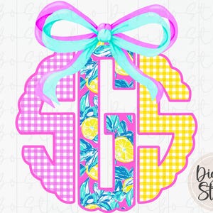 May include: A monogram design with the letters S, G, and S, featuring a pink gingham pattern on the left and yellow gingham on the right. The central letter has a lemon and leaf pattern. A bow with pink and turquoise ribbons adorns the top.