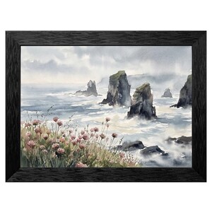 May include: Watercolor painting of a coastal scene with sea stacks and crashing waves. The artwork features a black frame, gray skies, and pink wildflowers in the foreground. The sea stacks are dark gray and green.