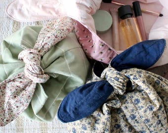 Make-uptassen met knoop
