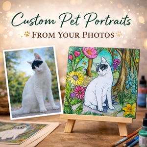 May include: The image displays custom pet portraits. A photograph of a white cat with black markings is next to a painting of a similar cat in a garden, displayed on a small wooden easel. The text reads "Custom Pet Portraits From Your Photos."