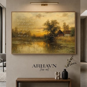 May include: A rectangular landscape wall art print featuring a golden sunset over a calm pond, trees, and a small house. The text reads: Be strong and courageous. Do not be frightened, and do not be dismayed, for the LORD your God is with you wherever you go.