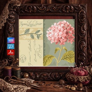 May include: A framed cross-stitch pattern featuring a pink hydrangea and a botanical illustration. The frame is dark brown with ornate carvings. The artwork includes text that reads "Eugene Luy Dorier" and "Paris".