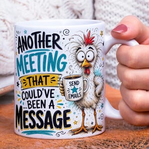 May include: A white ceramic mug featuring a cartoon chicken with wide eyes holding a small coffee cup that says SEND EMAILS. The text reads ANOTHER MEETING THAT COULD'VE BEEN A MESSAGE in black and teal lettering with yellow accents and stars.