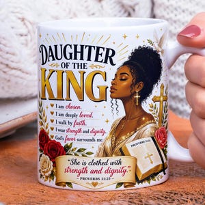 May include: A white ceramic mug featuring a graphic of a Black woman with an afro, a gold cross necklace, and a Bible. The text reads Daughter of the King, I am chosen, I am deeply loved, I walk by faith, I wear strength and dignity, God's favor surrounds me, and She is clothed with strength and dignity, Proverbs 31:25.