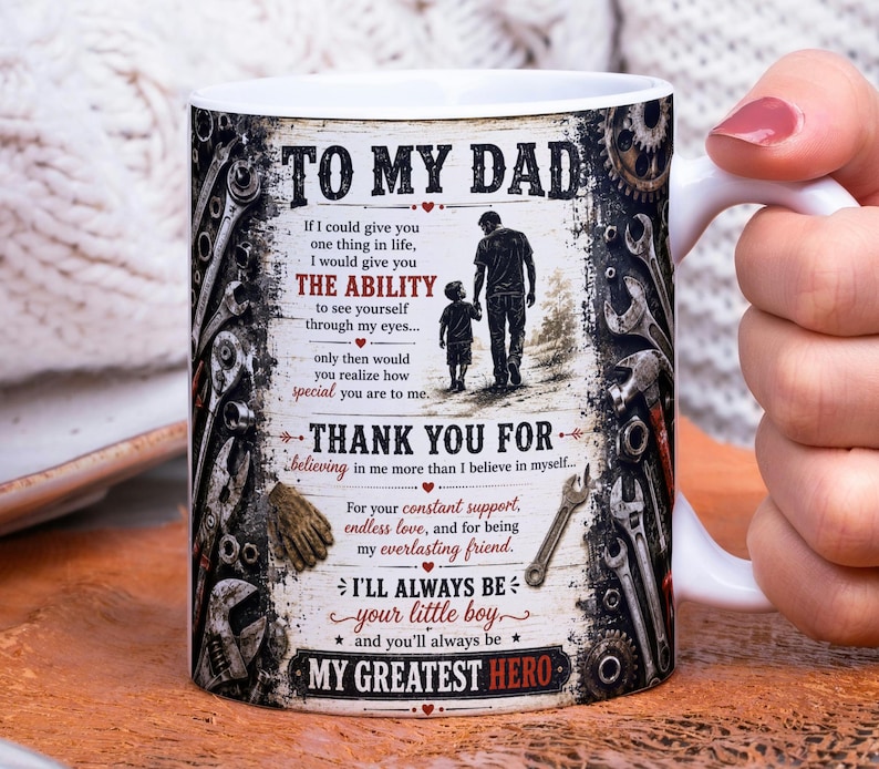 May include: White ceramic mug with a handle, featuring a design dedicated to a father. The mug has a rustic, vintage aesthetic with text that reads "TO MY DAD" and a heartfelt message. The design includes illustrations of tools and a father and son walking together.