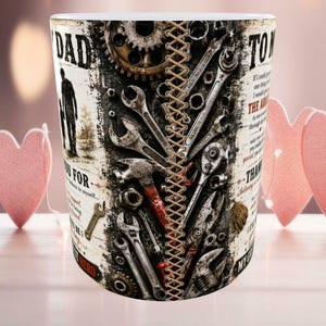 May include: A white ceramic mug with a design featuring tools, gears, and the word "DAD." The mug has a stitched leather-like design down the center and includes text that reads "Thank you for believing in myself..." and "My Hero."