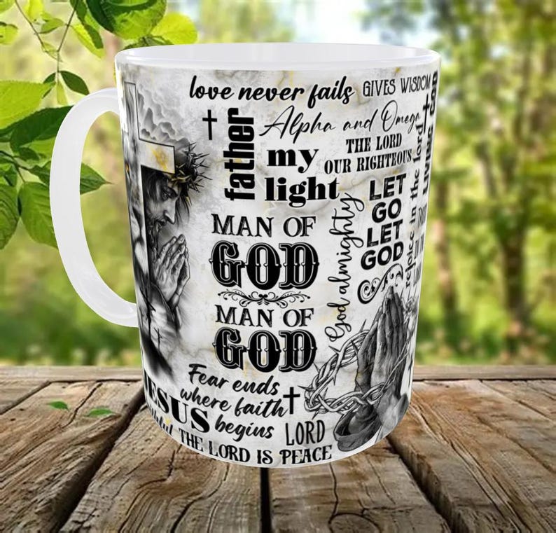 May include: White ceramic mug with a wraparound design featuring religious imagery and text. The design includes a depiction of Jesus, praying hands, and phrases like "Man of God" and "The Lord is Peace."