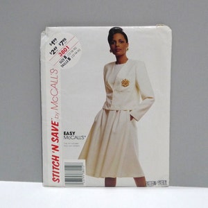 May include: A McCall's sewing pattern package featuring a woman in a cream-colored skirt suit. The package includes the text "STITCH 'N SAVE by McCall's" and "EASY McCall's". The size is B (12-14-16).