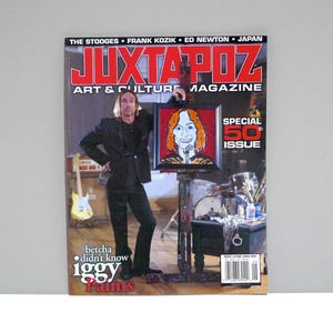 May include: A magazine cover for Juxtapoz Art & Culture Magazine featuring Iggy Pop. The cover has the text "Juxtapoz Art & Culture Magazine" in red and white. The cover also has the text "Special 50th Issue" and "Iggy Paints".