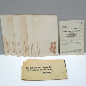 May include: A collection of vintage ephemera, including several cream-colored brochures for La Caverna Hotel in Carlsbad, New Mexico, and a receipt for guide service fees from Carlsbad Caverns National Park. Also included is a welcome pamphlet.